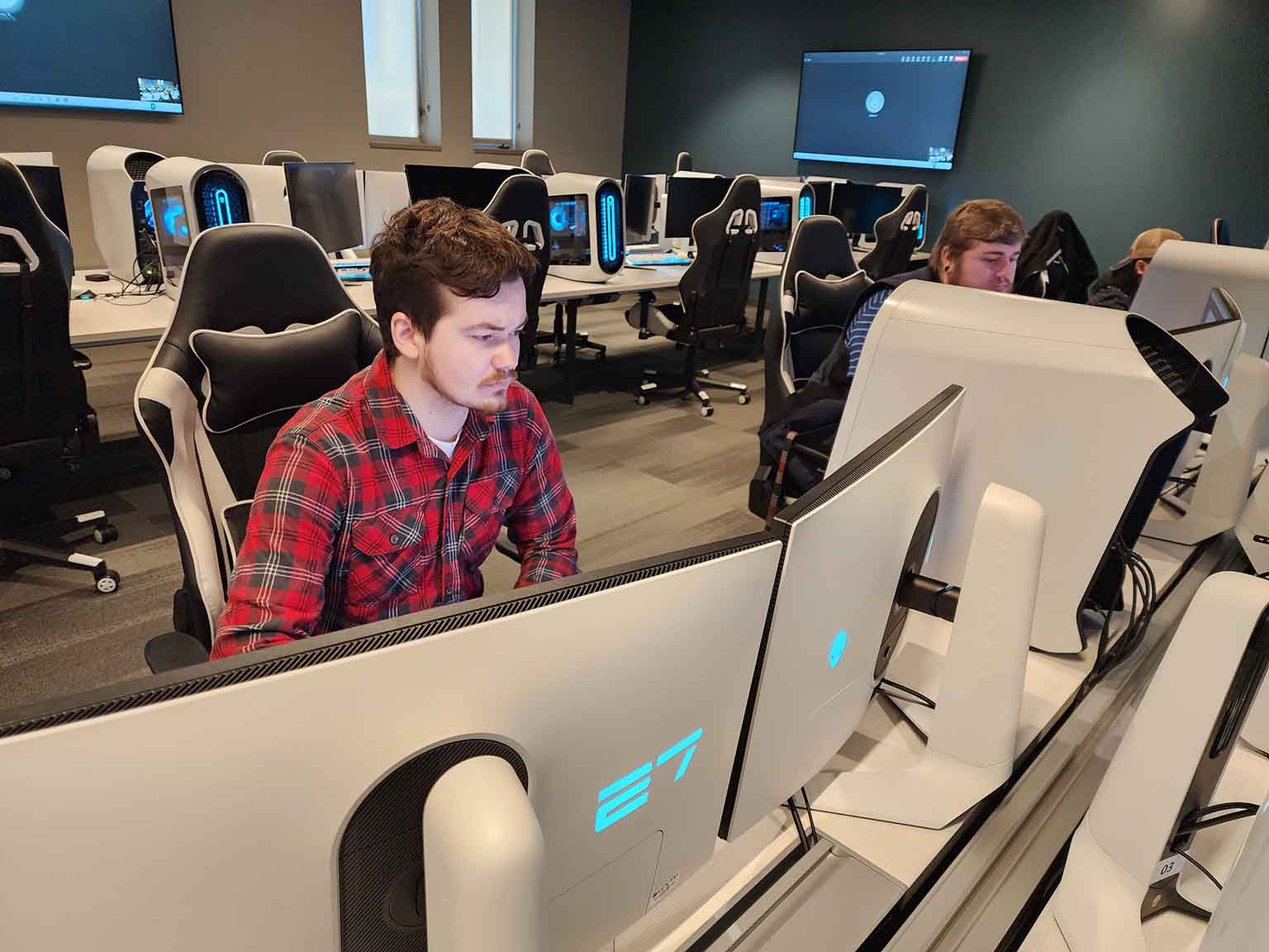 A male student looking at a computer screen.