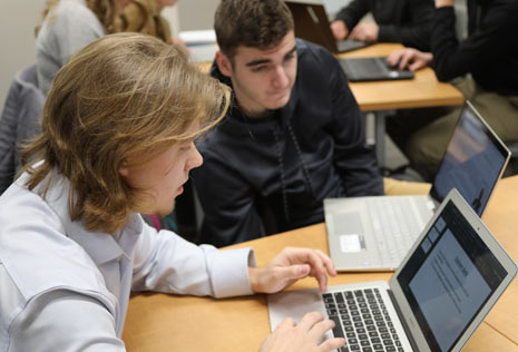 two males at college on computer