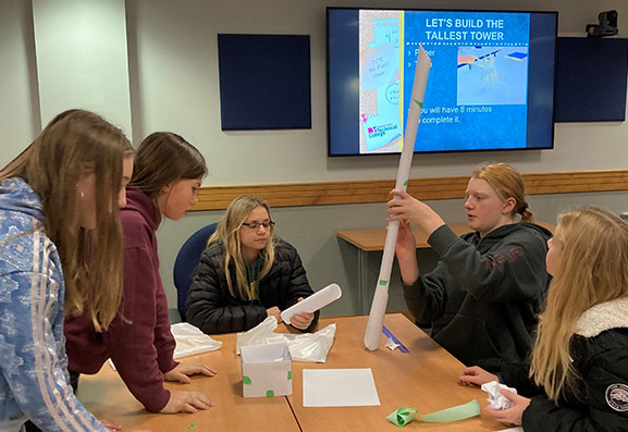 Students building a large tower