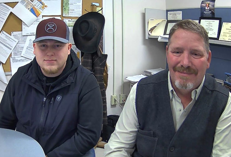 Two men dressed in casual clothes in an office